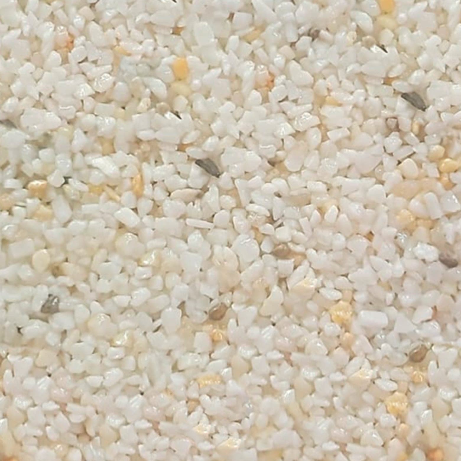 Muestra de granito granulado modelo Aurora Blanca, tono claro