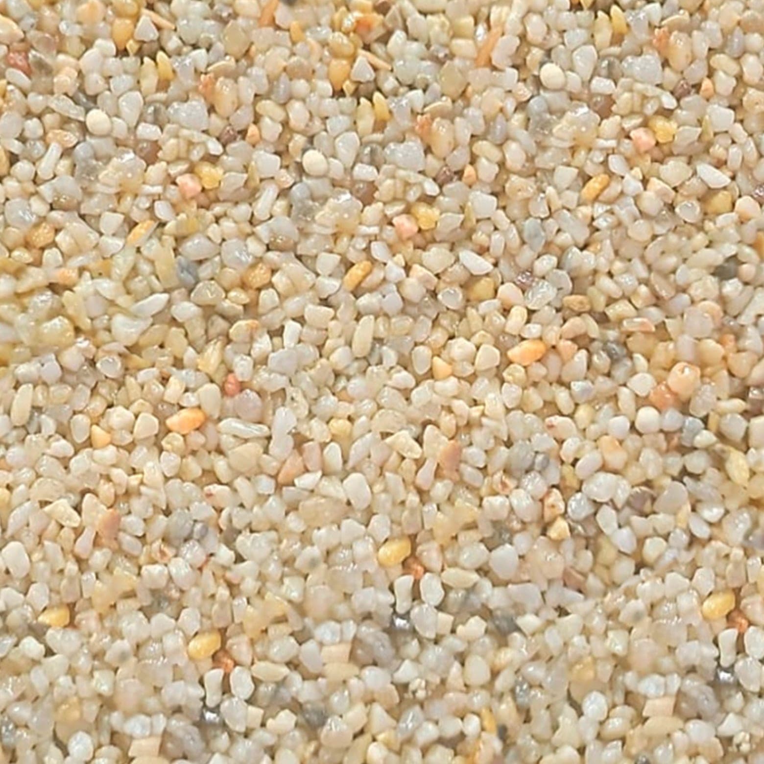 Muestra de granito granulado modelo Beige Luxury, tono claro cálido