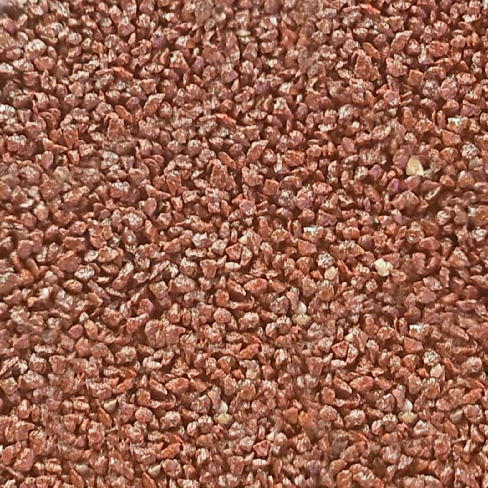 Muestra de granito granulado modelo Café Sol de Ónix, tono cálido